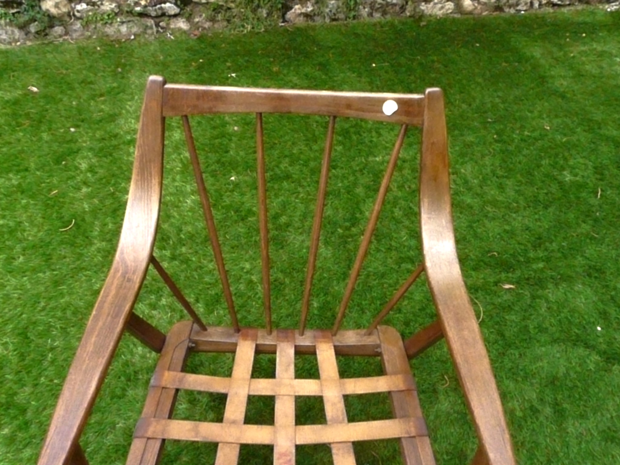 Fauteuil vintage aux accoudoirs courbés